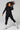 Black longline compression zip jacket full length lifestyle active outerwear - TLC Sport