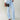 Tall woman wearing MODACCIO Livia Jean in light wash denim with white button-down shirt