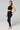 Compression panel leggings black faux leather side panel slimming hips thighs side view - TLC Sport