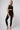 High waisted gym leggings black tummy control worn with matching crop bra - TLC Sport
