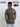 A shot from behind of a tall and slim guy in a studio and wearing a dark grey medium tall slim t-shirt.