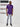 A head to toe shot of a tall slim guy in a studio and wearing a royal purple large tall slim t-shirt.