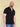 Tall slim man wearing an XL tall black zip polo shirt.