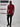 A head to toe shot of a tall slim guy  in a studio and wearing a cabernet large tall slim t-shirt.