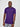 A tall and slim man in the studio standing in front of a light background. The smiling model is wearing an extra long slim royal purple t-shirt in a size large. The tall royal purple t-shirt features a 3" longer body, 100% organic cotton, and is soft & preshrunk. The  royal purple t-shirt is ideal for tall slim men 6'2"+.
