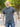 A tall and athletic man in a park standing on a path between trees. The smiling model is wearing an extra long slim dark slate polo shirt in a size XL. The tall dark slate polo shirt features a 3" longer body, 100% organic cotton, and is soft & preshrunk. The dark slate polo shirt is ideal for tall slim men 6'2"+. Buy 2 Save 10%, Buy 4 Save 15%, Buy 6 Save 20%.