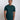 A tall and slim man in the studio standing in front of a light background. The smiling model is wearing an extra long slim dark teal t-shirt in a size medium. The tall dark teal t-shirt features a 3" longer body, 100% organic cotton, and is soft & preshrunk. The dark teal t-shirt is ideal for tall slim men 6'2"+.