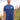 A tall and slim man standing by the sea. The smiling model is wearing a navy blue extra long graphic t-shirt with a minimal lake design. It features a 3" longer body, 100% organic cotton, and is soft & preshrunk. This extra long tall graphic tee is ideal for tall slim men 6'2"+
