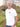 A tall and slim man standing by the sea. The smiling model is wearing a white extra long graphic t-shirt with a minimal landscape design. It features a 3" longer body, 100% organic cotton, and is soft & preshrunk. This extra long tall graphic tee is ideal for tall slim men 6'2"+.