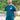 An upper body shot of a tall slim guy in a park wearing an XL tall and slim fitting graphic t-shirt in dark teal.