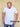 A tall slim man wearing an XL tall heavyweight white t-shirt and looking down at the Just Tall hem logo.