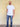 A head to toe shot of a tall slim guy wearing an XL tall white heavyweight t-shirt.