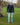 A head to toe shot of a tall athletic guy in a park wearing a black long sleeve tall t-shirt, looking to the right.