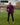 A head to toe shot of a tall athletic guy in a park wearing a dark purple long sleeve tall t-shirt.