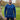 A tall and slim man standing in a park. The smiling model is wearing a navy blue long-sleeve tall t-shirt. The tall navy blue long-sleeve t-shirt features a 2.5" longer sleeves, 100% organic cotton, and is soft & preshrunk. The navy blue long-sleeve t-shirt is ideal for tall slim men 6'2"+.