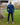 A head to toe shot of a tall athletic guy in a park wearing a navy long sleeve tall t-shirt.