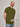 A tall athletic guy standing in a studio and wearing ab olive XL tall t-shirt, smiling and hands behind back.