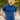 A tall and athletic man in a park standing on a path between trees. The smiling model is wearing an extra long slim navy polo shirt in a size XL. The tall navy polo shirt features a 3" longer body, 100% organic cotton, and is soft & preshrunk. The navy polo shirt is ideal for tall slim men 6'2"+.