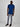 A head to toe shot of a tall slim guy  in a studio and wearing a navy large tall slim t-shirt.