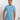 A studio shot of a tall slim guy wearing a medium tall slim pastel blue t-shirt.