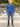 A head to toe shot of a tall athletic guy in a park wearing an XL tall extra long cobalt quarter zip sweatshirt.