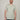 A tall and slim man in the studio standing in front of a light background. The smiling model is wearing an extra long slim sage green v-neck t-shirt in a size XL. The tall sage green v-neck t-shirt features a 3" longer body, 100% organic cotton, and is soft & preshrunk. The sage green v-neck t-shirt is ideal for tall slim men 6'2"+.