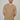 A tall and slim man in the studio standing in front of a light background. The smiling model is wearing an extra long slim tan t-shirt in a size XL. The tall tan t-shirt features a 3" longer body, 100% organic cotton, and is soft & preshrunk. The tan t-shirt is ideal for tall slim men 6'2"+.
