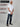 A head to toe shot of a tall muscular guy  in a studio and wearing a white XL tall t-shirt.