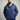 A tall and broad guy standing in a studio and wearing a 2XL Tall dark navy zip-up hoodie.