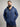 A tall and broad guy standing in a studio and wearing a 2XL Tall dark navy zip-up hoodie.