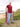 A head to toe shot of a tall slim guy wearing an XL tall graphic t-shirt with a tree design.