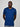 A tall and slim guy in the studio, hands behind back and wearing a navy blue L tall slim v-neck t-shirt.
