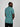 A shot from behind of a tall and slim guy in the studio and wearing a teal L tall slim v-neck t-shirt.