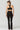 Black slim fit bootcut compression leggings bum lifting back view worn with crop bra - TLC Sport